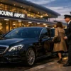 Melbourne airport to city transfers luxury chauffeur car outside airport terminal