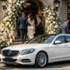 Luxury Wedding Chauffeur Melbourne white first class sedan with chauffeur at wedding venue