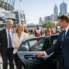 Corporate AFL Grand Final Packages 2026 with executive chauffeur Melbourne arriving in a luxury first-class sedan at the MCG