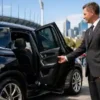 Private Chauffeur Melbourne for AFL Grand Final arriving at the MCG in a luxury black SUV with a professionally dressed chauffeur