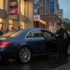 Private Chauffeur for MIFF Multi-Venue Transfers with a luxury dark blue Mercedes-Benz E-Class executive sedan outside a Melbourne International Film Festival venue