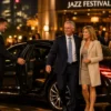 Corporate Chauffeur for Melbourne Jazz Festival with a black Mercedes-Benz S-Class and professional chauffeur without a hat welcoming VIP business clients outside a Melbourne jazz venue